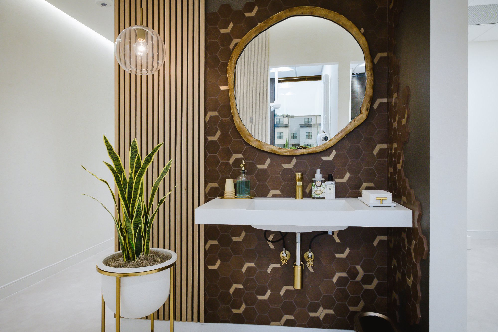 POSH Smiles luxury dental office washroom with gold accents