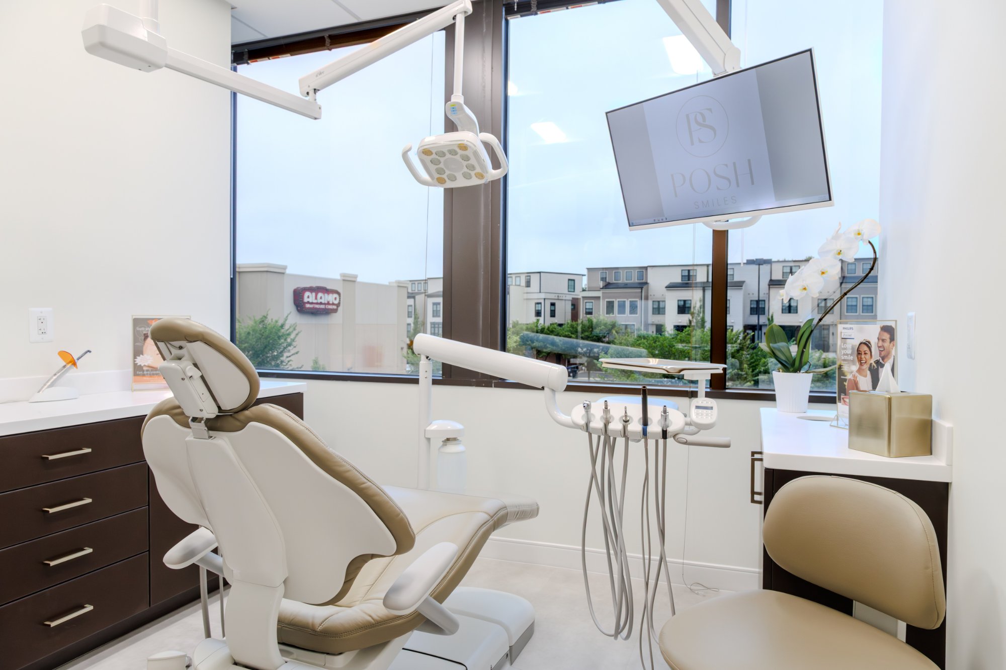 Modern dental treatment room with window view at POSH Smiles
