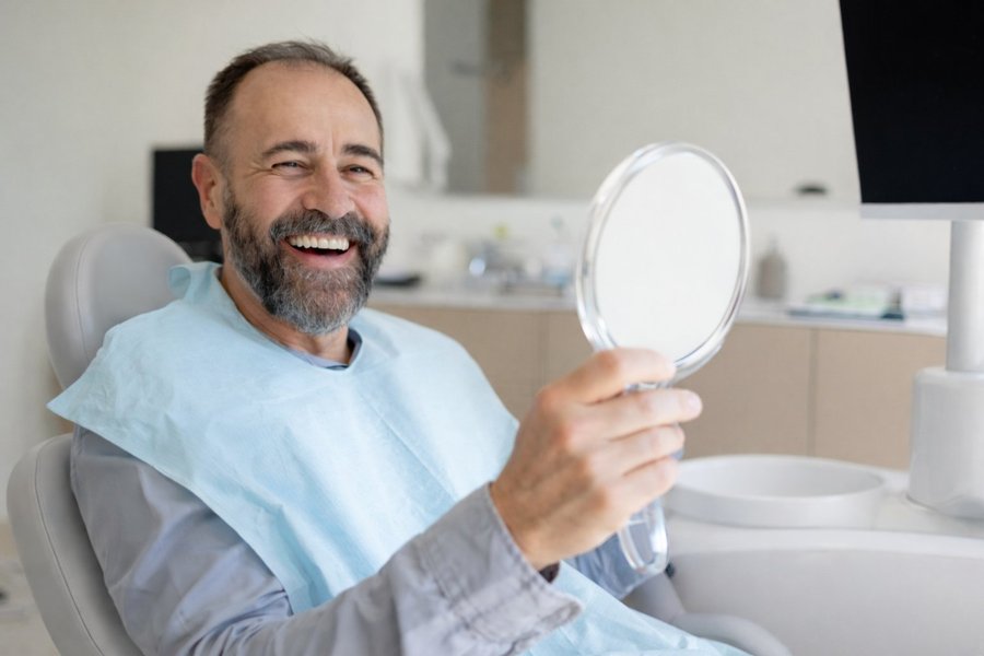 Happy patient reviewing results at POSH Smiles Ashburn VA