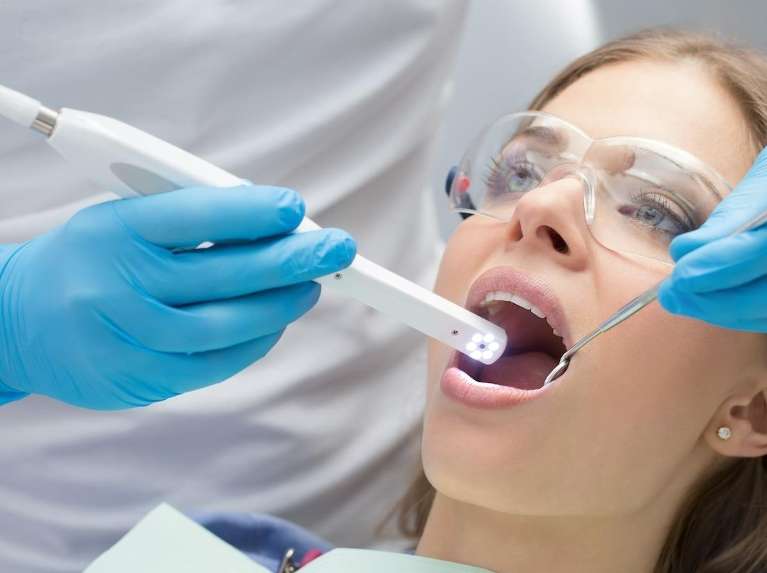 An intraoral camera being used on a patient in a dentists office, ashburn va