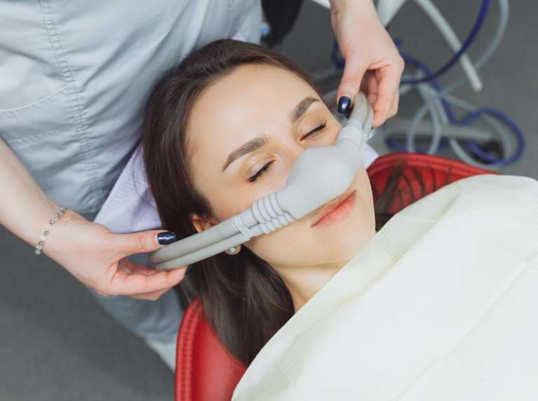 Nitrous oxide being administered on a patient at posh smiles in ashburn va 