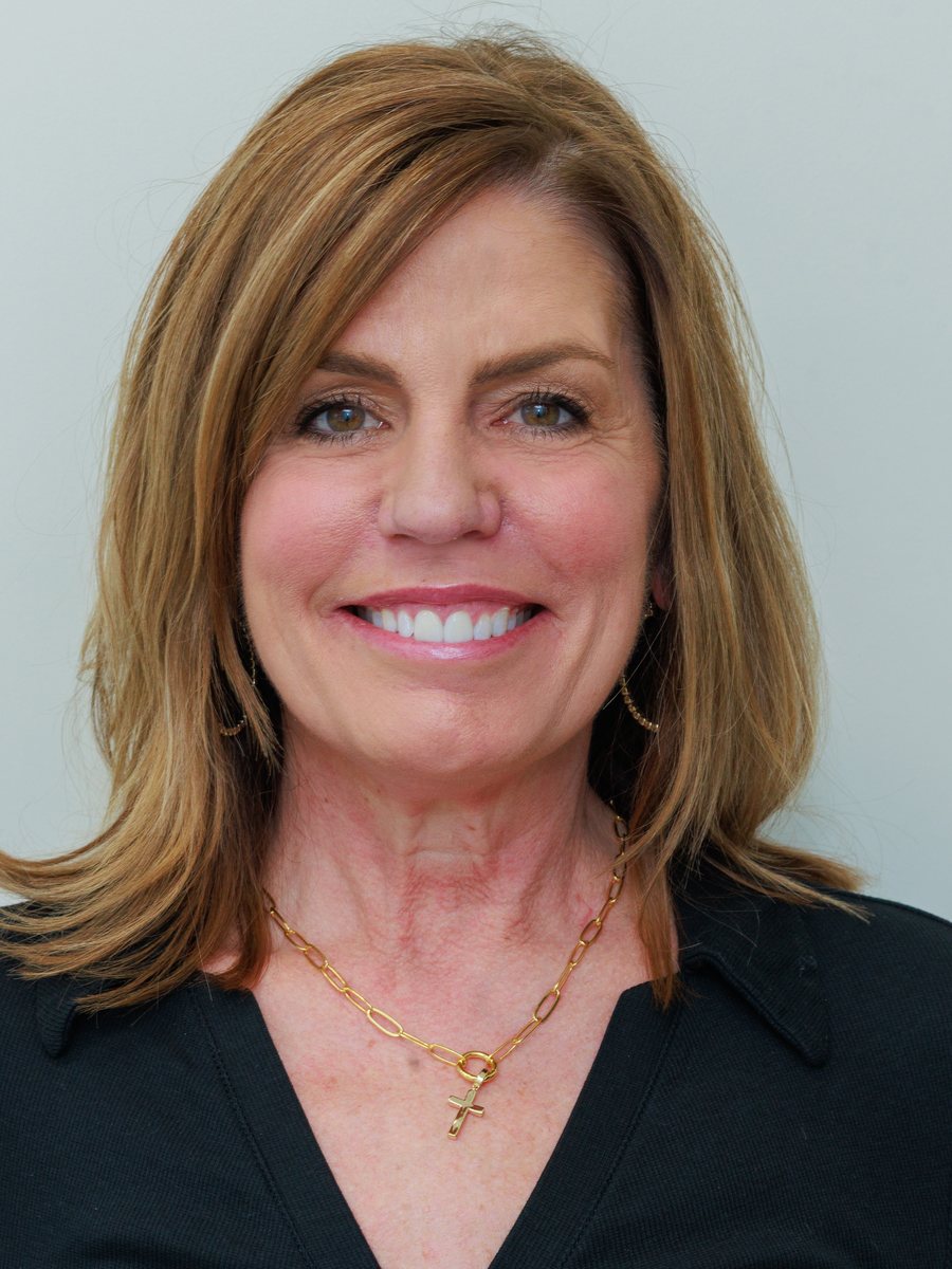 Actual POSH Smiles patient smiling after professional teeth whitening in Ashburn, VA